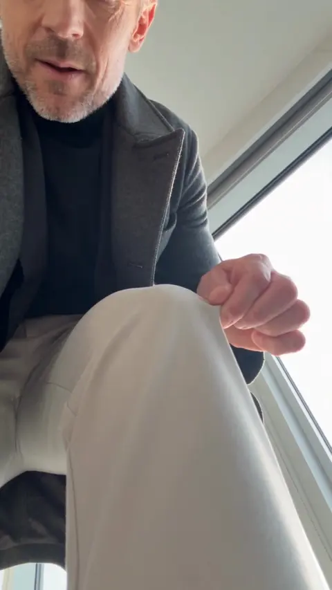 Real Pinnora output: first-person UGC frame of a man stretching